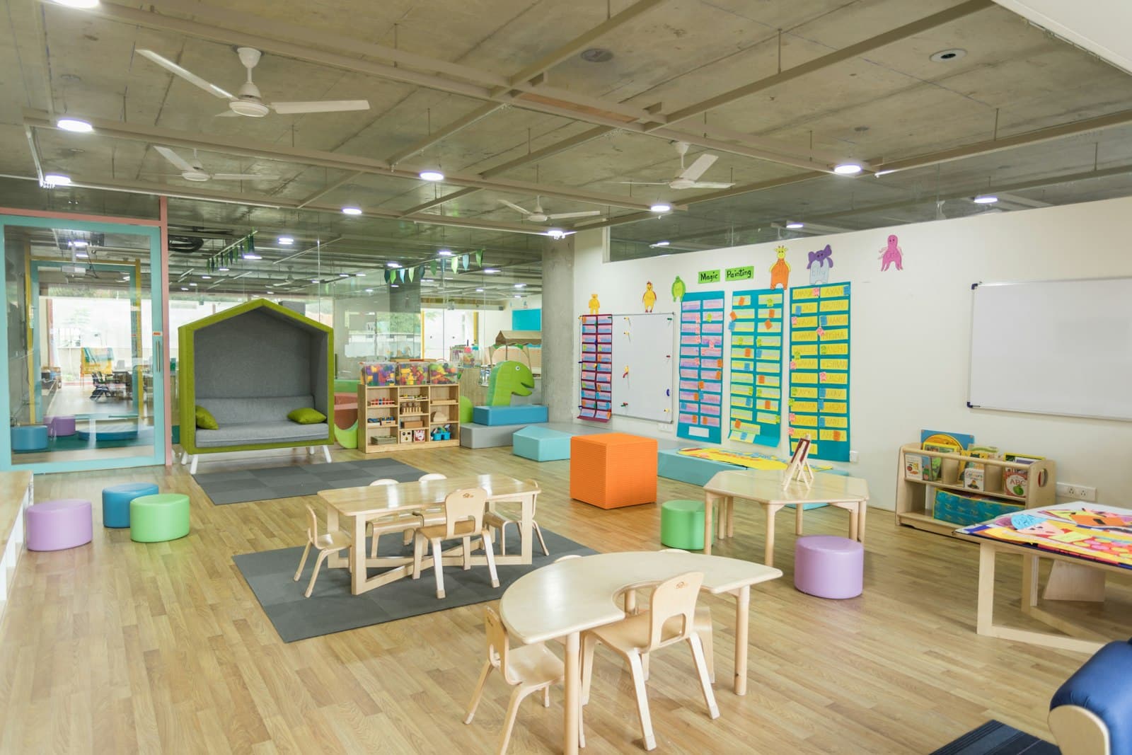 A nursery room with low shelves and natural light