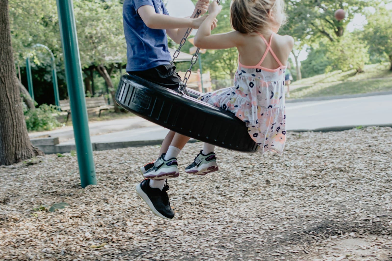 A child on a swing outdoors